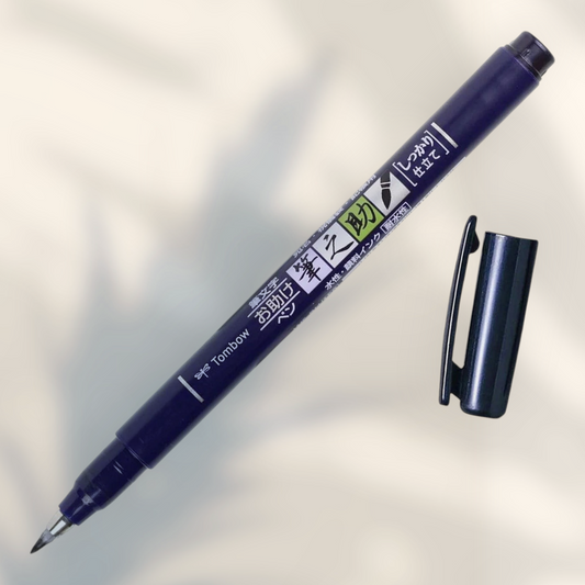 Eira Haul Tombow Fudenosuke black hard tip calligraphy brush pen with cap removed for hand lettering and drawing