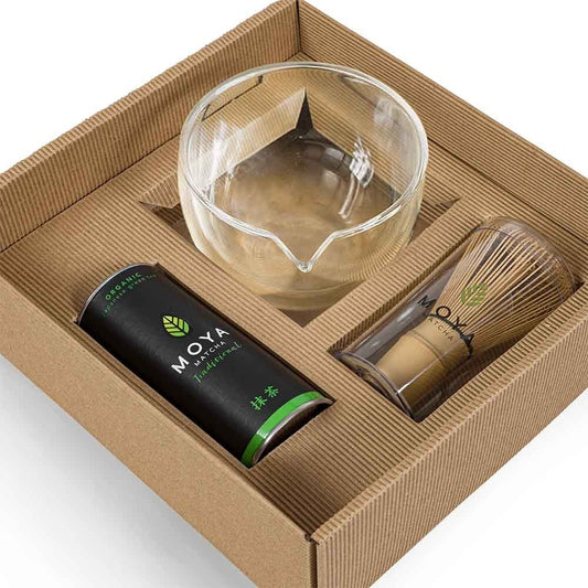 Traditional matcha starter set with a glass bowl and spout for preparing matcha tea.
