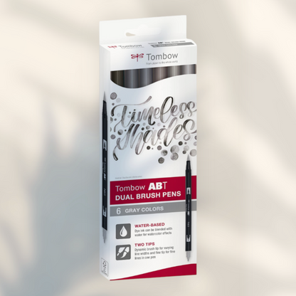 Eira Haul Tombow ABT Dual Brush 6-pack in gray shades with flexible brush and fine tips for calligraphy and drawing.