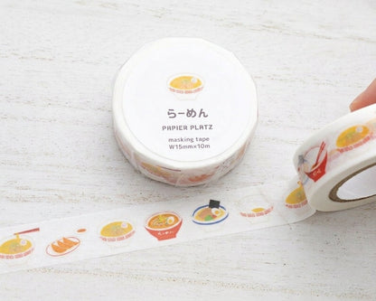 Japanese washi tape featuring a ramen-themed design by Kamoi Kakoshi on a table.