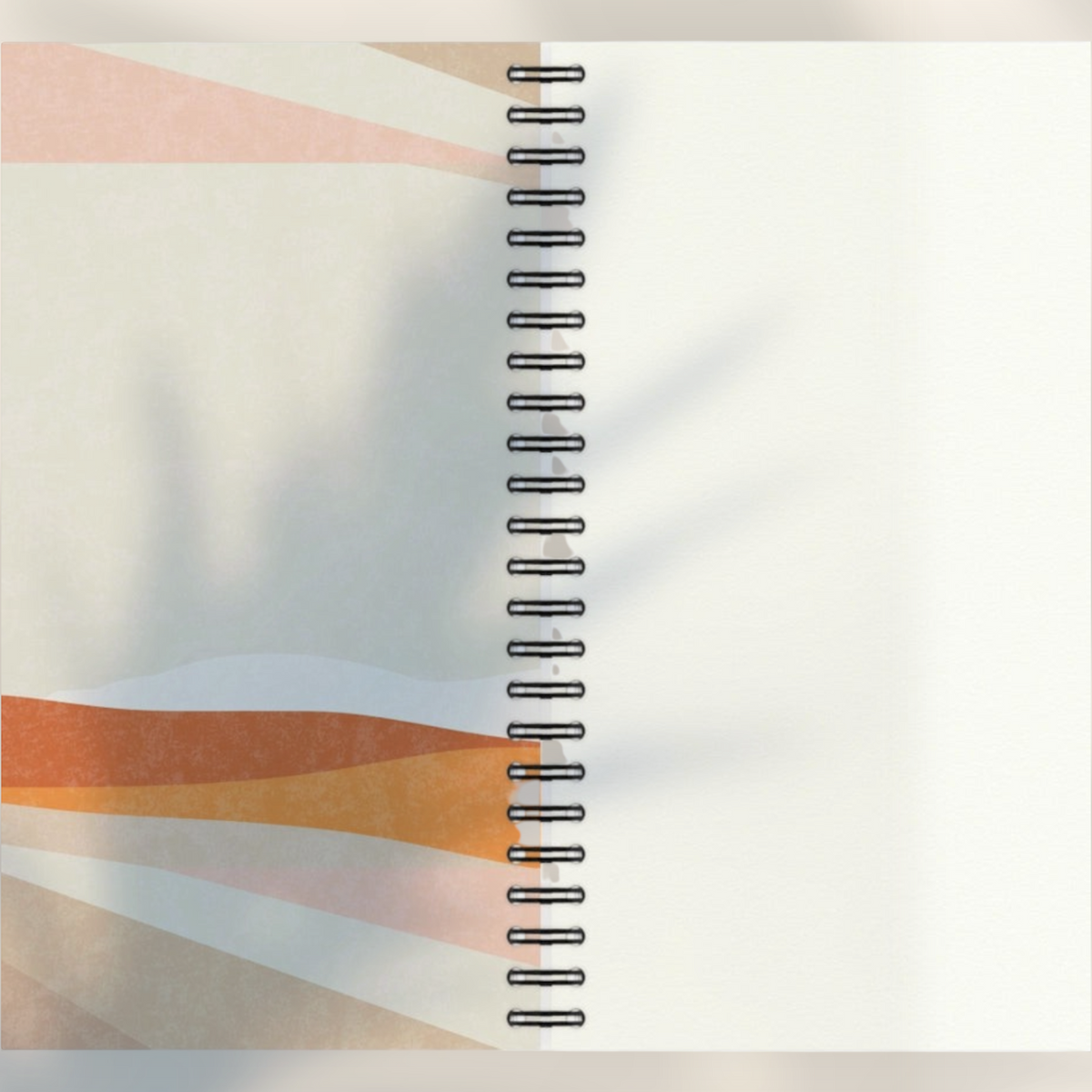 Eira Haul A5 notepad with abstract geometric shapes in terracotta and beige, featuring black wire comb binding.