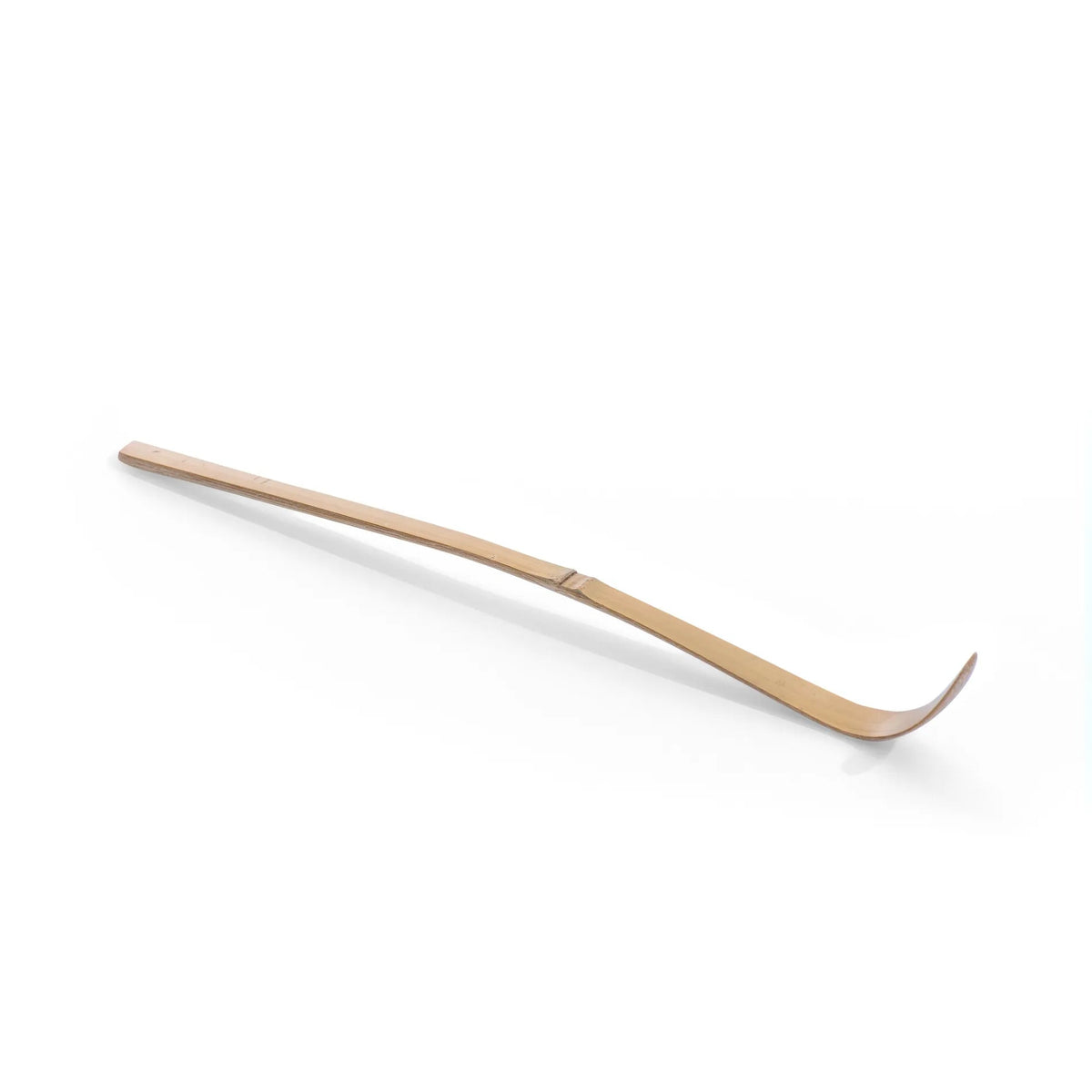 Traditional Japanese matcha bamboo spoon (chasaku) for measuring and preparing matcha tea.