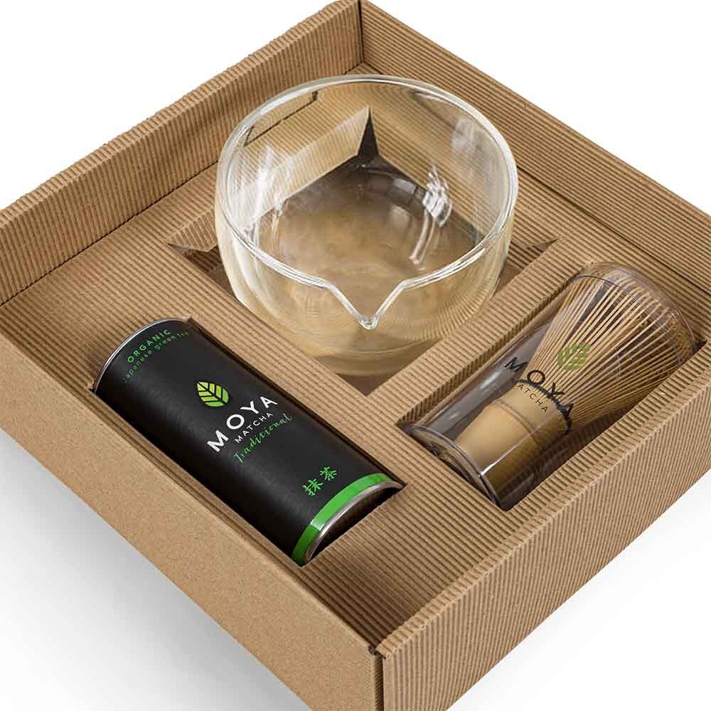 Traditional matcha starter set with a glass bowl and spout for preparing matcha tea.