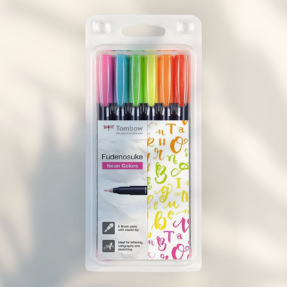 Eira Haul set of six Tombow Fudenosuke neon hard tip brush pens in clear plastic blister packaging for calligraphy